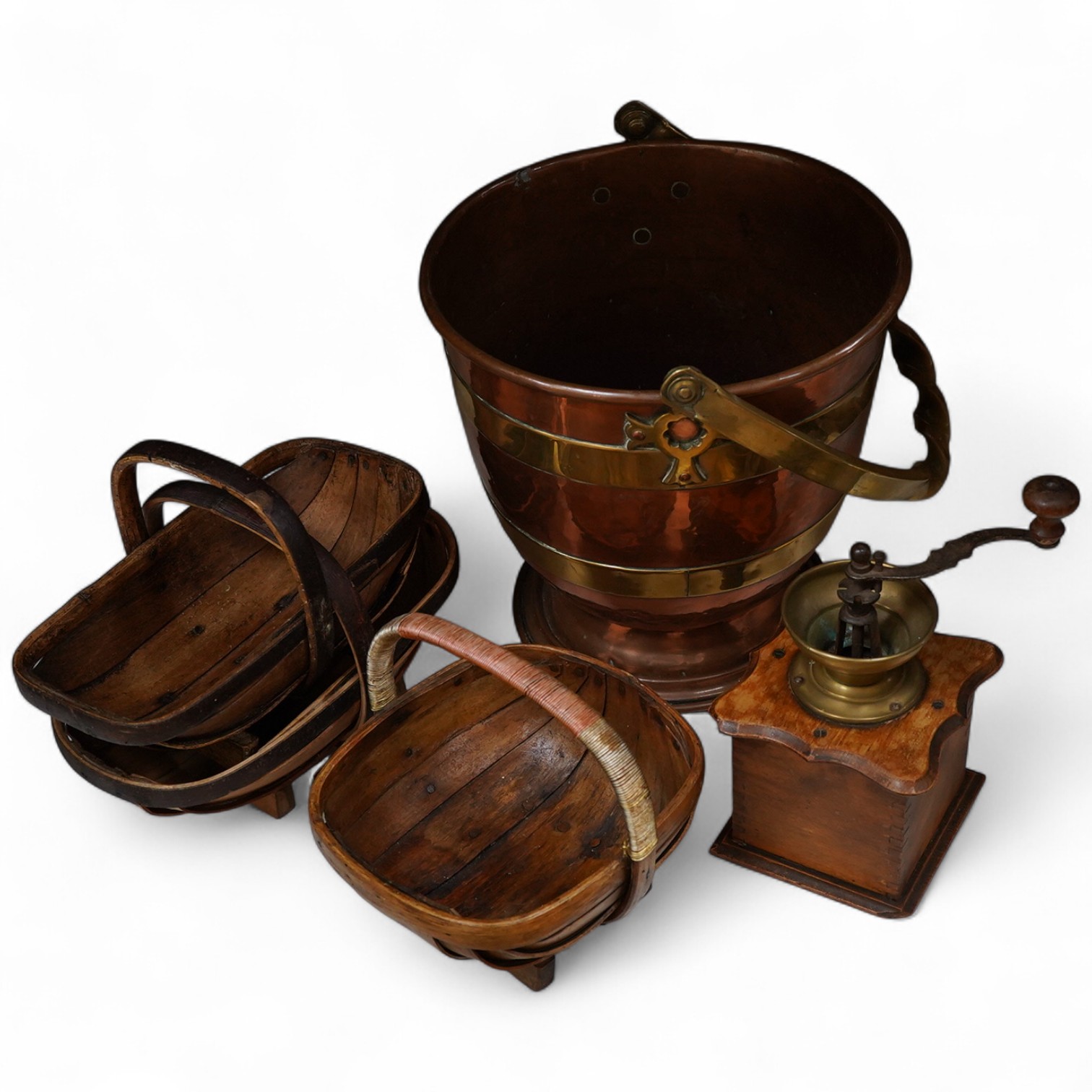 Brass and copper pedestal log-box three Sussex trugs and coffee mill, log box 32cm high